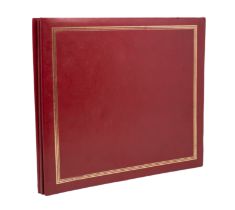 A collection of autographs within a red faux leather album. Autographs include British T.V stars,