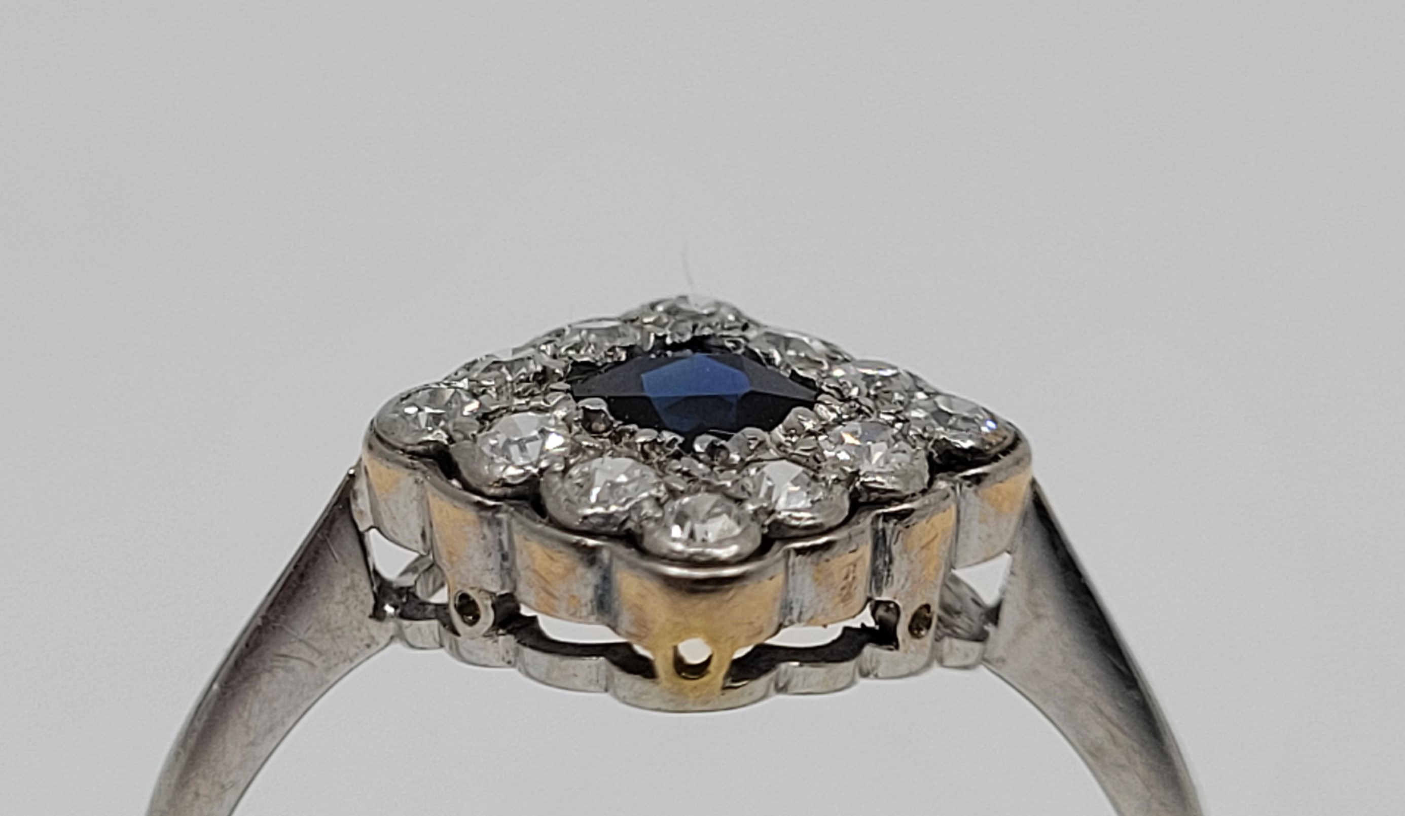An 18ct. gold, platinum, sapphire and diamond cluster ring, the lozenge mount set French cut - Image 3 of 3