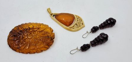 A pair of graduated and faceted cherry amber bead drop earrings, hook fitting, length 6.4cm,