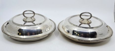 A pair of Victorian silver circular entrée dishes and covers, by William Wrangham Williams, London