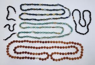A string of orange-brown amber beads, of spherical form, each approx. 9.5mm diameter, strung as a