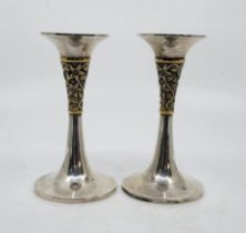 A pair of parcel gilt silver candlesticks, by Nicholas Plummer, London 1996, having gilt silver