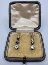 A pair of Victorian yellow metal and diamond drop earrings, articulated, each set three graduated