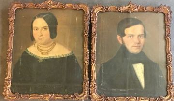 A pair of Early 19th cent oil on canvas portraits