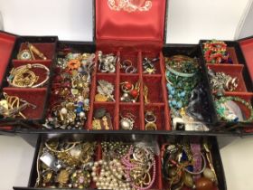 A large collection of costume jewellery, stored in faux leather jewellery box. (qty)