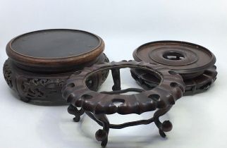 A collection of three Chinese wooden stands (the one a/f)