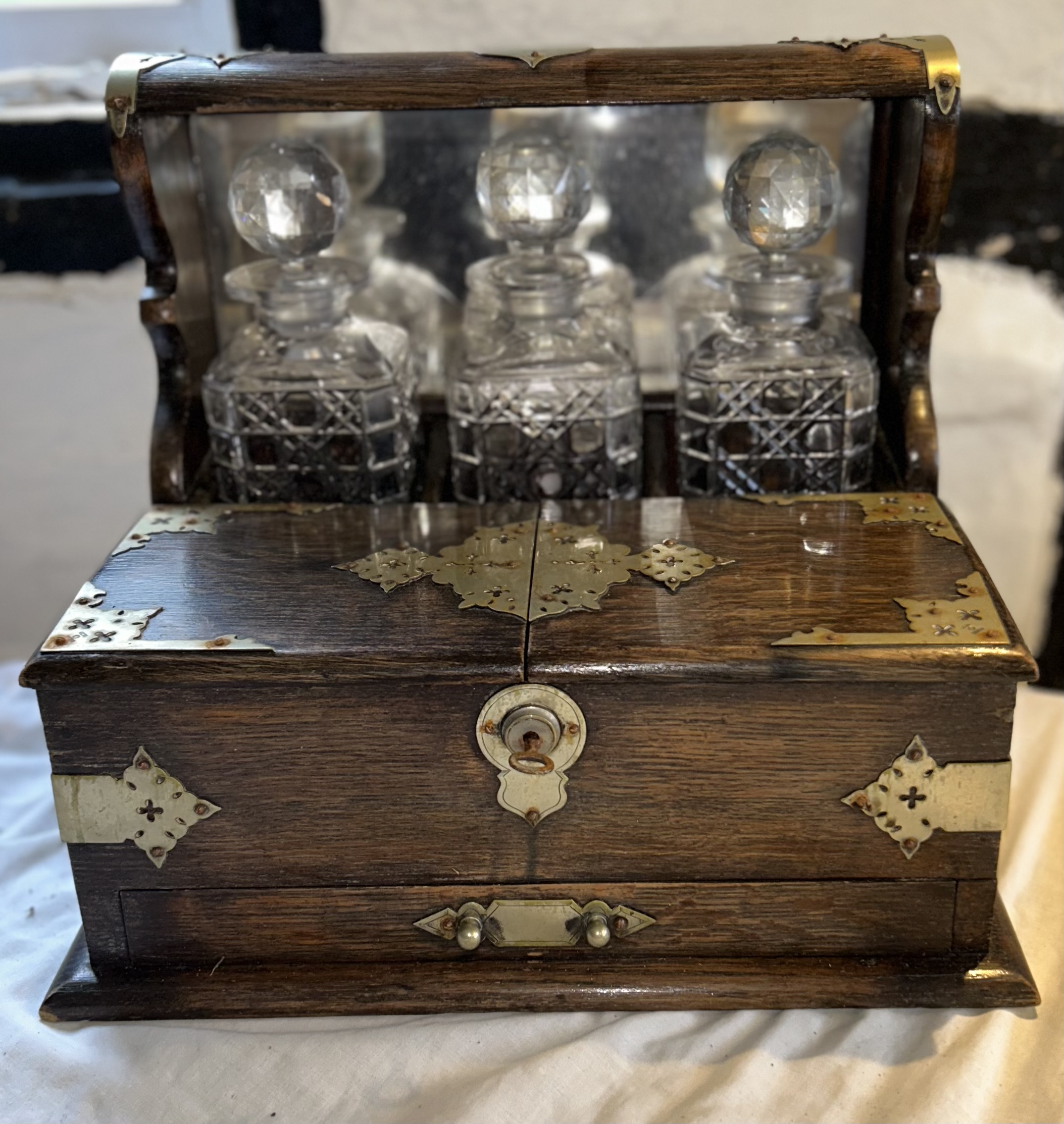 An early 20th cent games Tantalus complete with key, awarded to a member of the magic circle