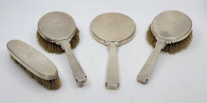 An Art Deco style engine turned silver dressing table set, by William Comyns & Sons Ltd, London