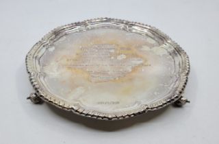 A silver circular presentation salver, by Viner's Ltd, Sheffield 1962, having lobed gadrooned rim