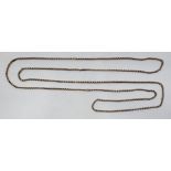 A 9ct. rose gold guard chain, fashioned from belcher and elongated links, length 151cm. (28.3g)