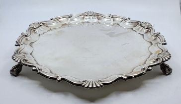 A silver salver, by Goldsmiths and Silversmiths Company Ltd, London 1905, with shell and scroll