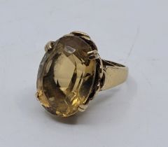 A 9ct. gold and citrine dress ring, set large mixed oval cut citrine, size UK O 1/2-P. (gross weight