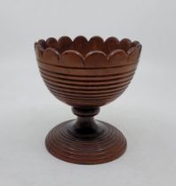 A late George III lignum vitae sweetmeat dish, circa 1800, having pie crust rim and reeded bowl