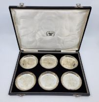 A set of six Indian silver coasters, each engraved sailing ship to reserve, stamped "Silver" to