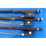 A 20th cent students violin and three bows one probably silver mounted