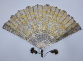 A very scarce mid 19th century Russian parcel gilt, silver and yellow metal Brise fan, the sticks