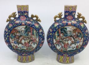 A pair of 19th century Chinese Qing dynasty Famille rose moon flasks, height 24cm. (2) Condition