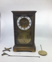 A 19th cent brass mantle clock with subsidiary dials