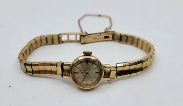 A Cyma 9ct. gold ladies' bracelet watch, manual movement, having signed silvered circular dial