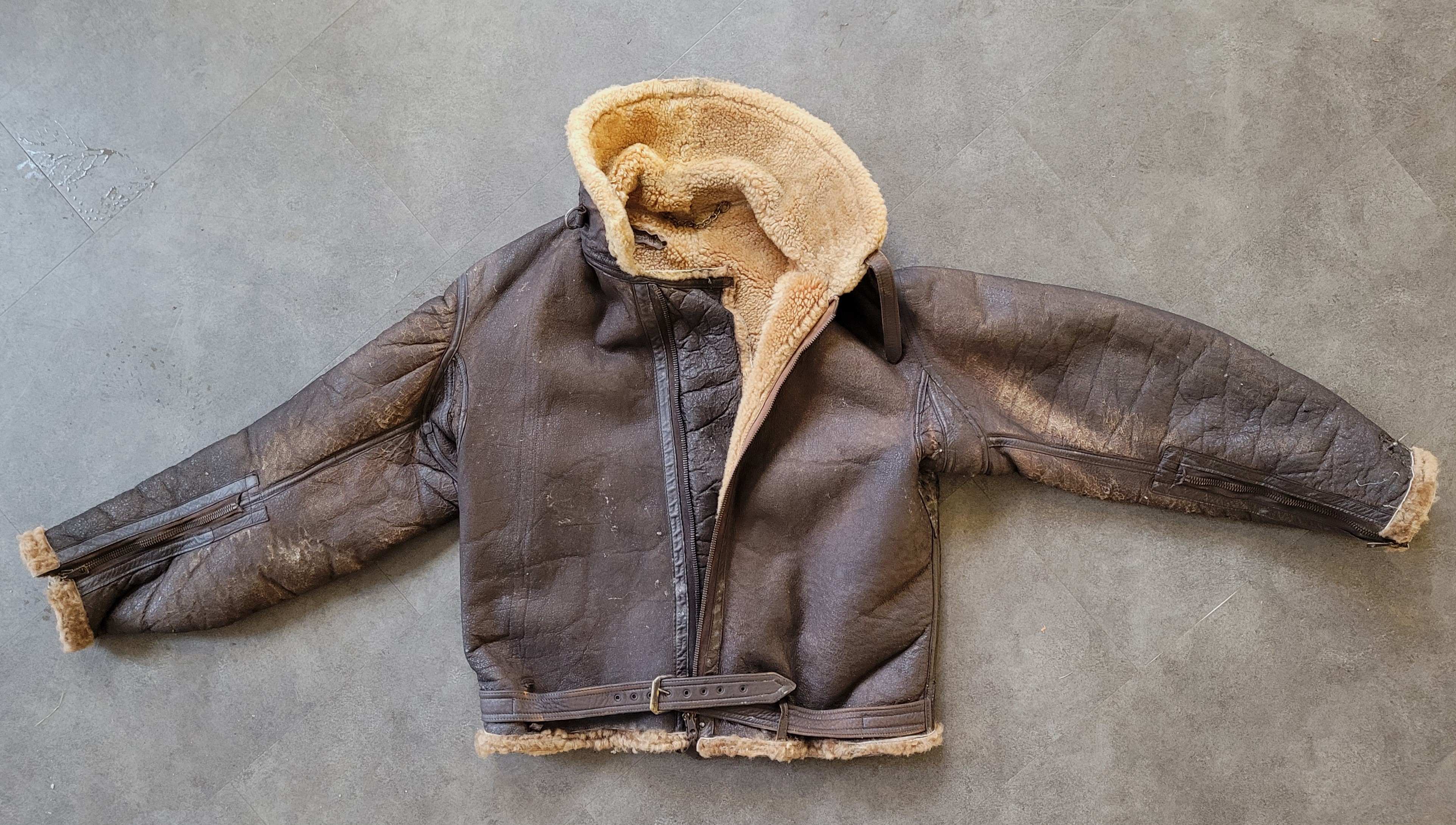 An RAF Irvin style leather and sheepskin lined flying jacket. Condition Note: some teeth to main zip