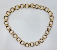 A heavy yellow metal fancy link necklace, fashioned from cushion shape rope twist links