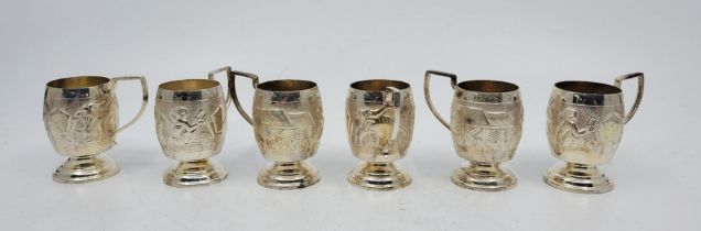 A set of six miniature Indian sterling silver tankards, the side repousse elephant and villager in a