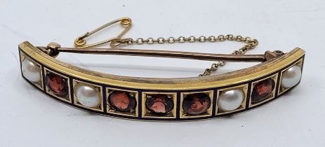 A yellow and rose metal, garnet, pearl and blue enamel curved brooch, set five mixed round cut