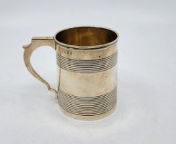 A George III silver christening mug, by Elizabeth Morley, London 1811, with bands of ribbed