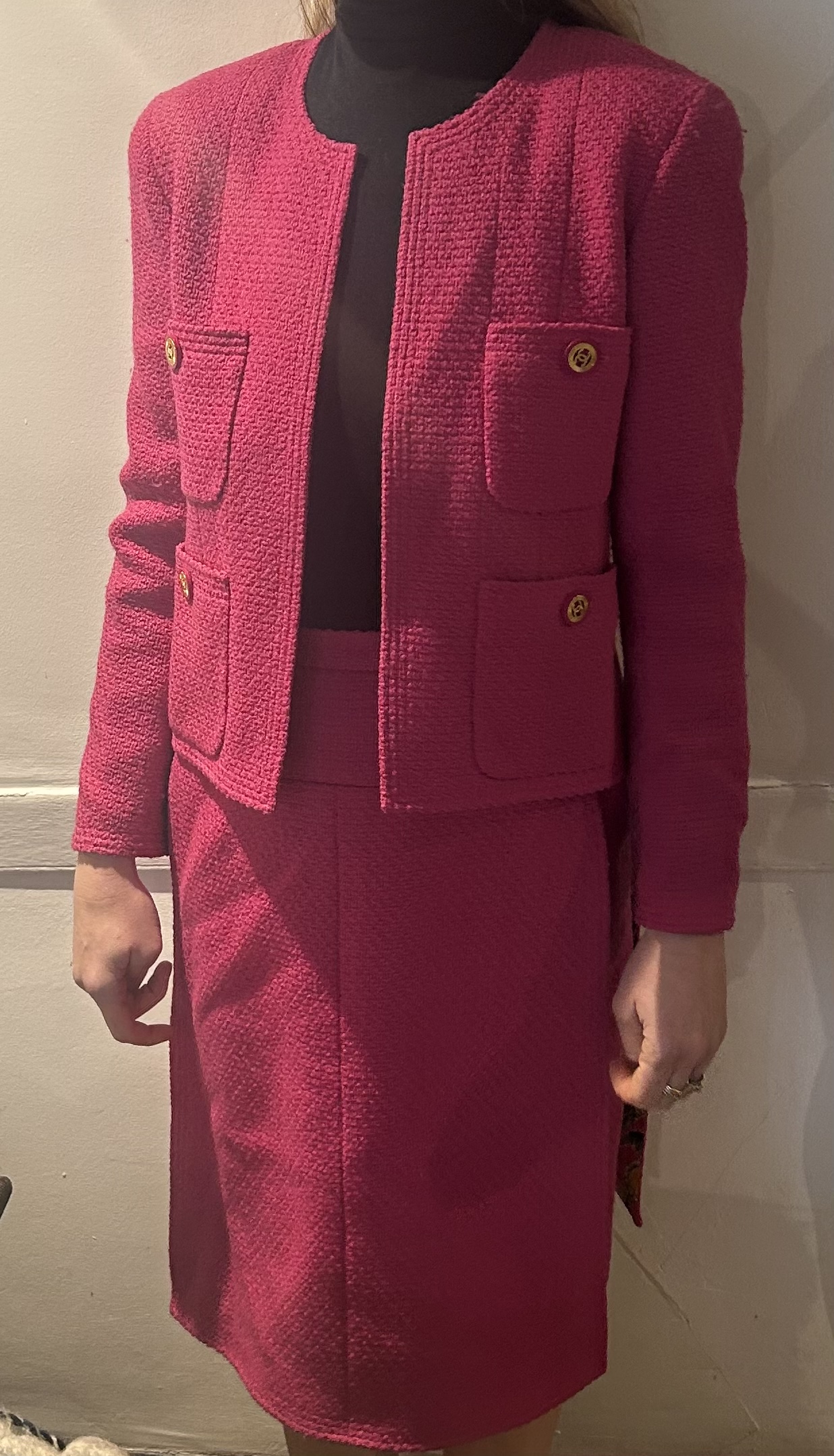 A Chanel Boutique "Hot Pink" two piece boucle suit, the jacket with printed silk lining four