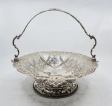 A George III silver swing handled oval basket, by William Plummer, London 1768, having shell and
