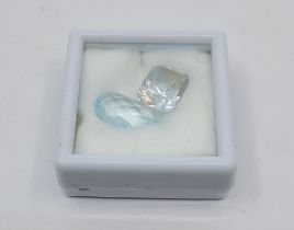 A pear-shape briolette-cut aquamarine, (EAW 6.10 carats), together with a scissors type cut white