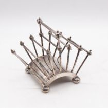 Christopher Dresser for Hukin & Heath - A novelty silver plated six division toast rack, having