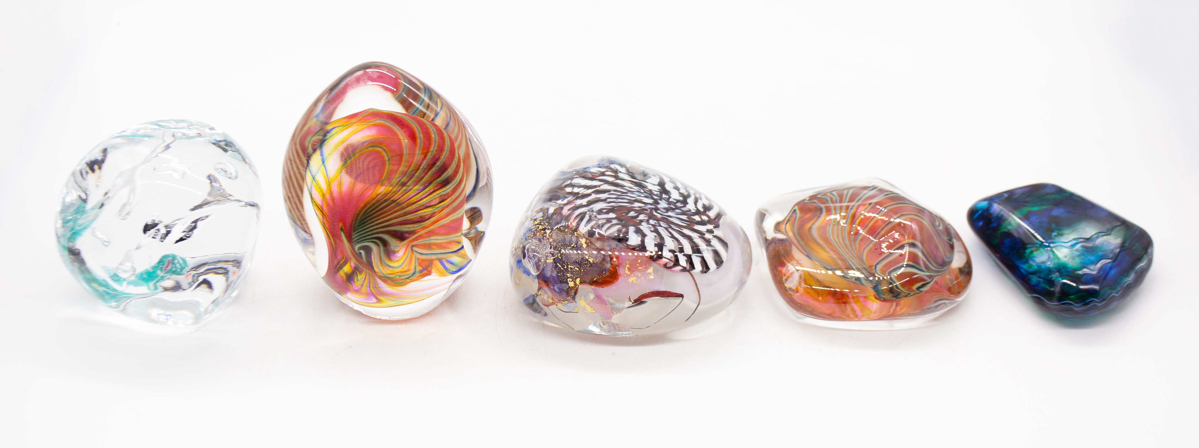 Studio glass paperweights comprising a Peter Layton iridescent paperweight, 2 Layne Rowe striped