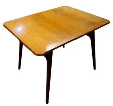 A single 20th century Everest Maple style walnut table with extra leaf inside, having tapering
