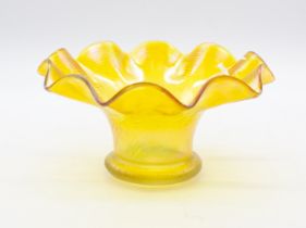 Kralik Glass - An iridescent yellow glass bowl, of swirl fluted form.