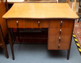 An Everest maple five drawer desk, in walnut with stained wood support, legs and handles, lockable