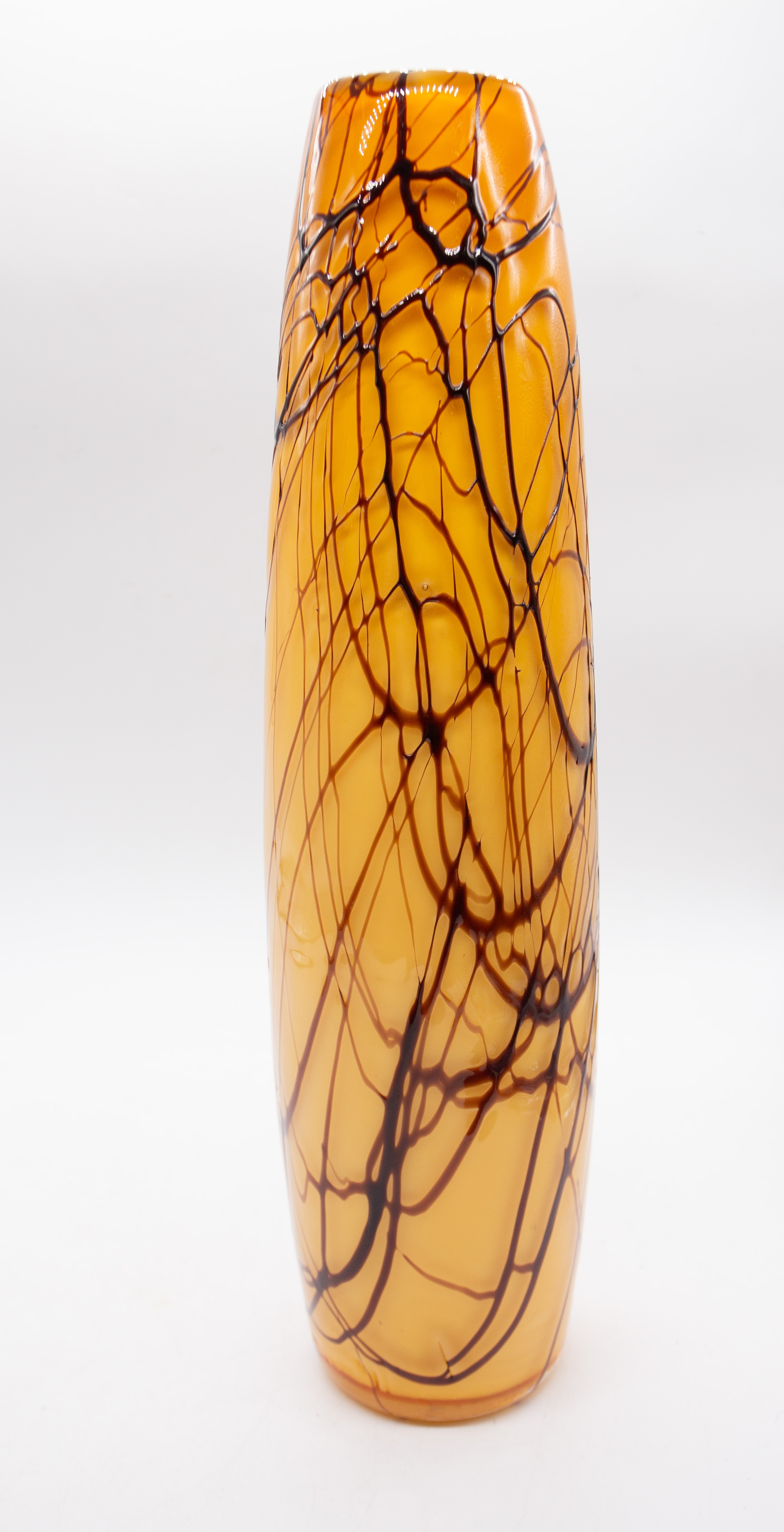 A tall stylish Murano style 20th century amber coloured glass vase, having trailed brown design to