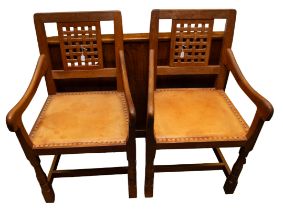Robert "Mouseman" Thompson of Kilburn - A pair of oak carver chairs, both having lattice backrests