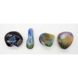 Studio glass paperweights 3 pebble paperweights in iridescent designs plus a dark blue paperweight