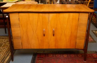 An Everest 'Helix' walnut credenza, with maple interior, inlaid doors and stained beech supports,