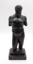 A bronze figure of a male, most likely of Septimius Severus depicted in heroic nudity, the stepped