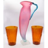 Studio glass. A small group comprising a pair of brown crackle glaze vases and a tall jug pink body,