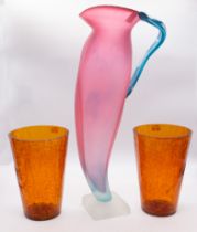 Studio glass. A small group comprising a pair of brown crackle glaze vases and a tall jug pink body,