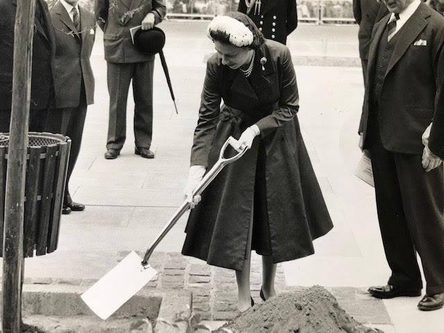 Queen Elizabeth vintage press photograph. Planting a tree at a public engagement. Press stamp on rev - Image 3 of 5