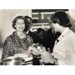 Queen Elizabeth II, charming image of her visit to a school 1960/70. Press photograph stamped on rev