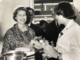 Queen Elizabeth II, charming image of her visit to a school 1960/70. Press photograph stamped on rev