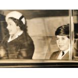 Queen Elizabeth II vintage press photograph with the now King Charles III in a car. Around 1960 (S22