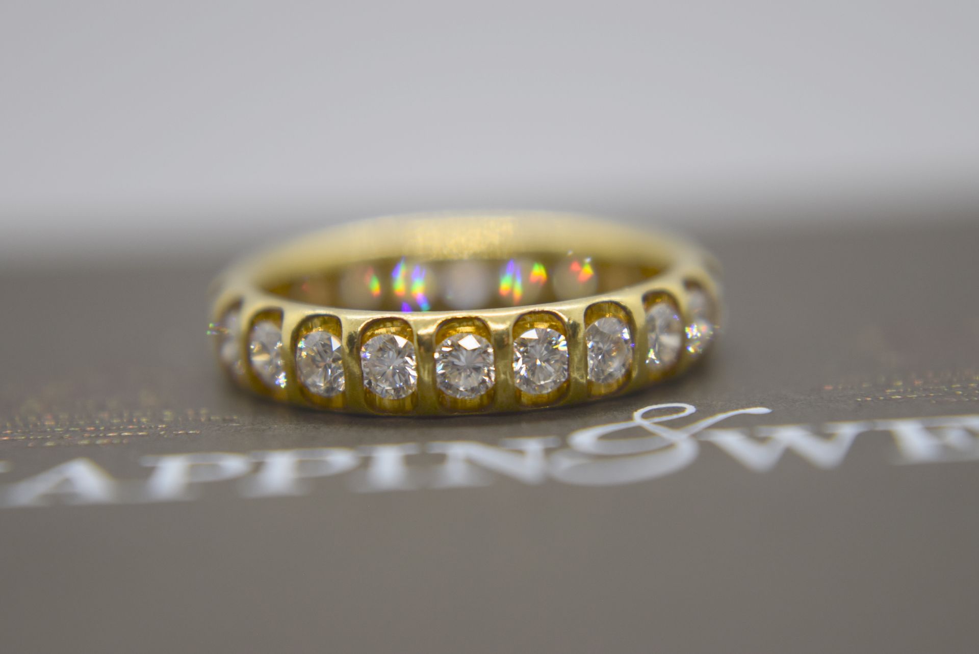 1.30CT DIAMOND ETERNITY RING IN 18K YELLOW GOLD (VS-SI DIAMONDS APPROX.) - SIZE J 1/2