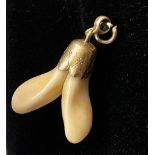 Antique stag / elk / deer tooth set in gold