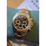 ROLEX DAYTONA 18K YELLOW GOLD/ STEEL REF. 16523 (U SERIAL) WITH WATCH REGISTER CERTIFICATE